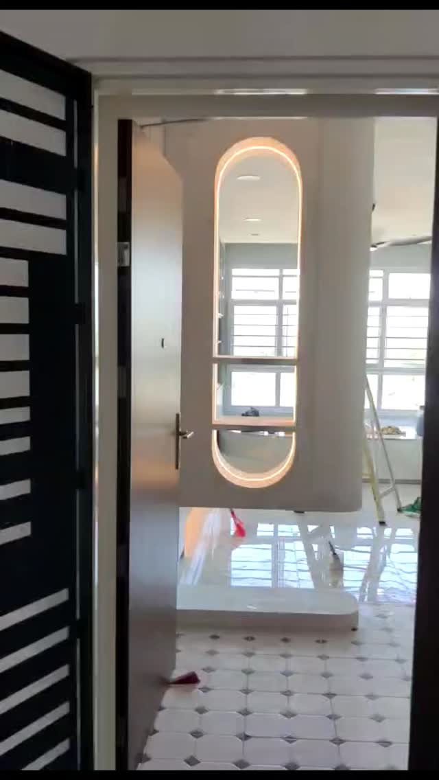 Pill-shaped backlit mirror frame, in-progress site shot